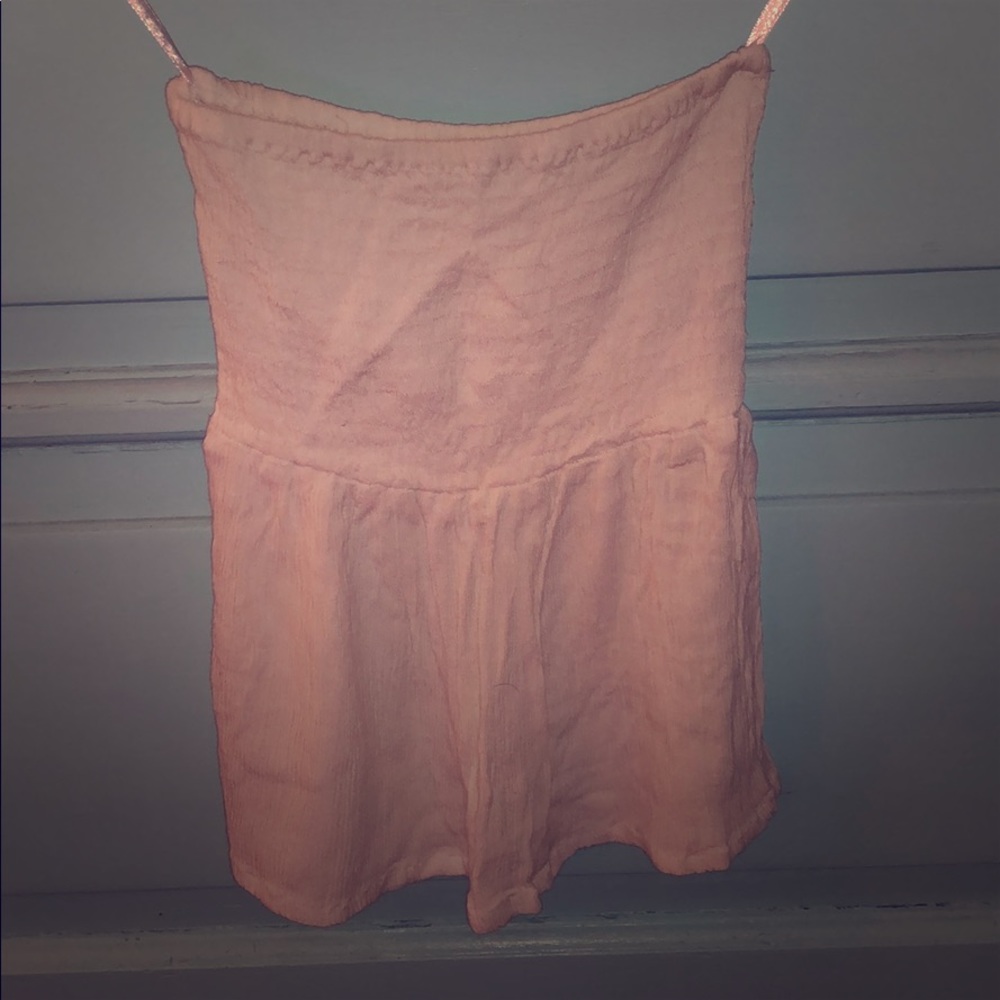 Strapless top, beachy. White, fun, rouge at bust.